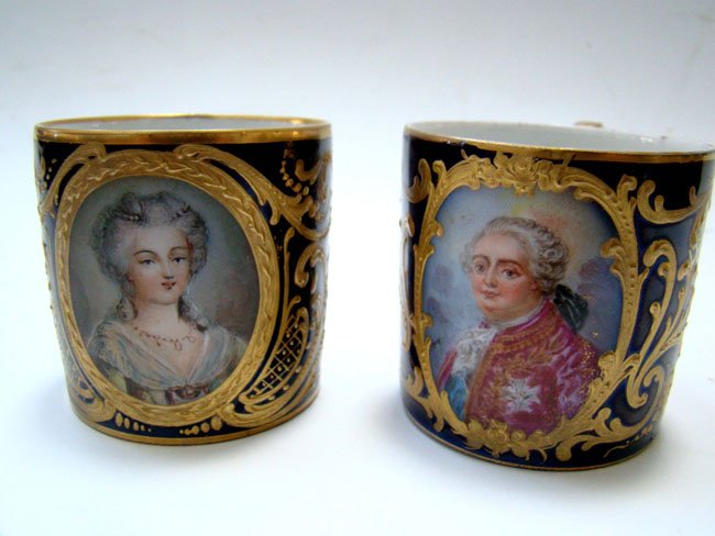 A fine pair of late 18th or early 19th century French bone china cups featuring Marie Antoinette and